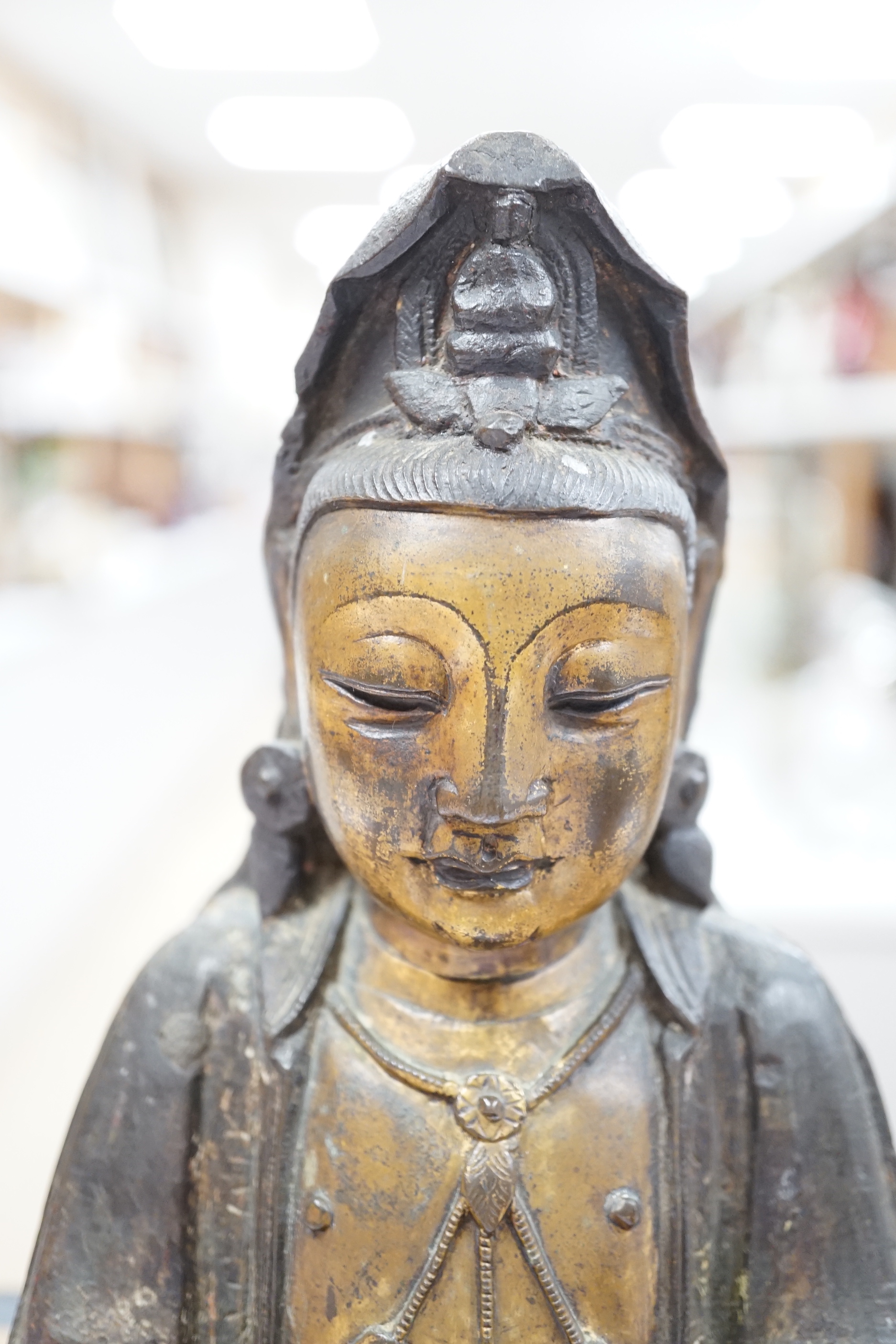 A Chinese Ming gilt bronze figure of Xi Wangmu, Queen Mother of the West, late 16th / early 17th century, Provenance: bought from the 50th Chelsea Antiques Fair, R & D Coombes, 1980, 24cm high